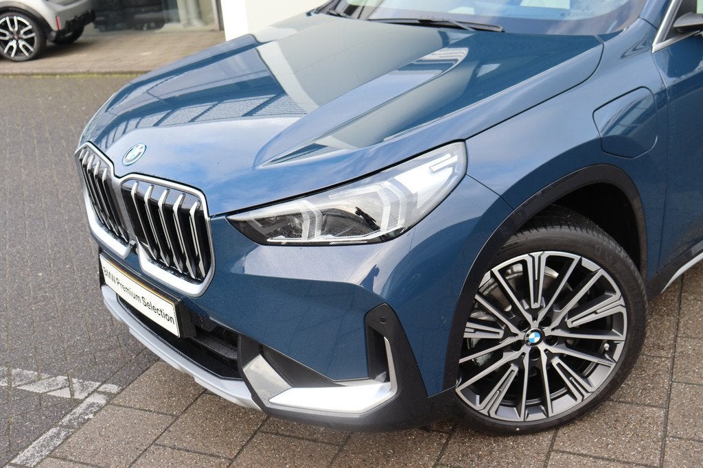 BMW X1 xDrive30e High Executive xLine Automaat / Panoramadak, Auto's, BMW, 1800 kg, Euro 6, Blauw, Leder en Stof