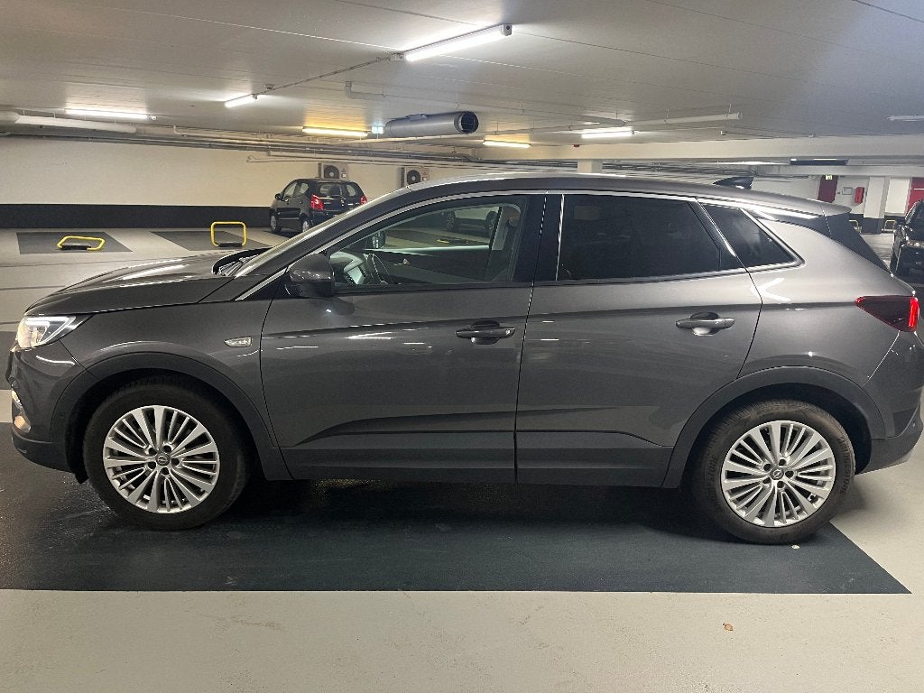 Opel Grandland X 1.2 Turbo 130pk S&S Aut 2020 Grijs, Auto's, Opel, Voorwielaandrijving, 15 km/l, 1199 cc, Leder en Stof