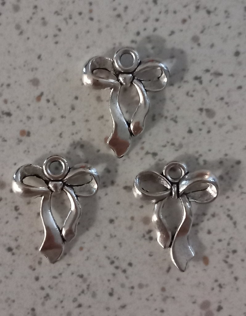Strikje metalen bedels, Ophalen of Verzenden, Nieuw, Bedel