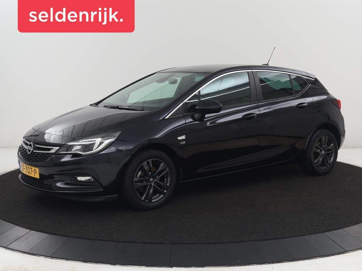 Opel Astra 1.0 Turbo 120 Jaar Edition | Carplay | DAB radio, Auto's, Stof, Gebruikt, Blauw, 610 kg