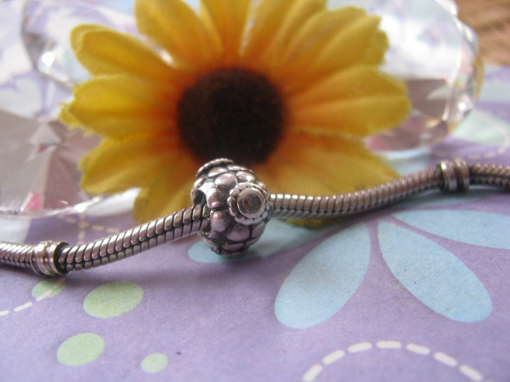 Pandora bedel P337 = zonnebloem # sunflower + 3 x zirk BRUIN, Gebruikt, Pandora, Ophalen of Verzenden, 1 bedel