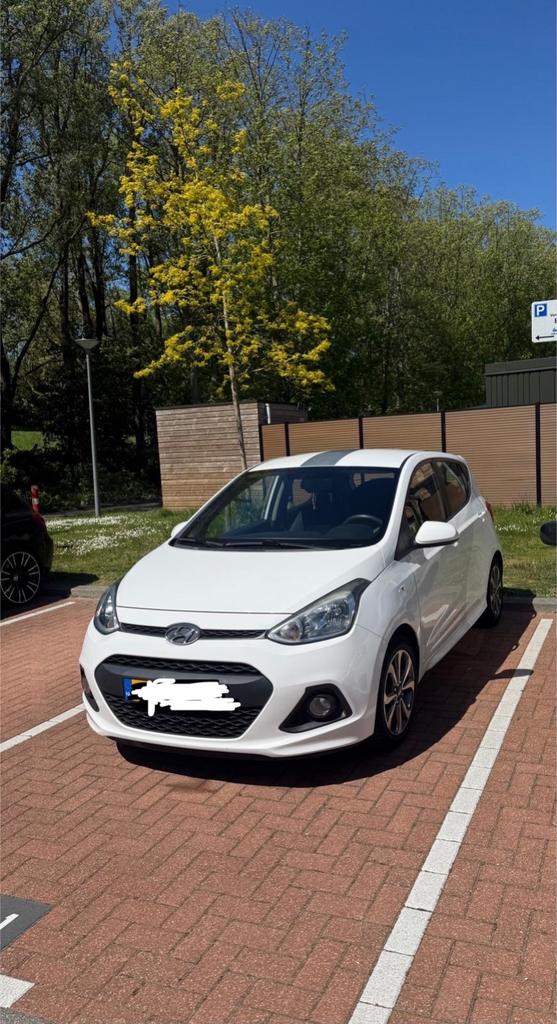 Hyundai i10 2015 met lichte lakschade, Auto's, Hyundai, Euro 5, Wit, Handgeschakeld, Metallic lak