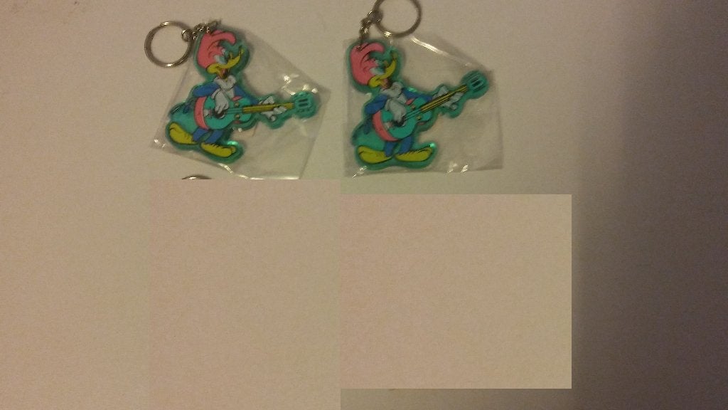 Woody Woodpecker gitaar strip sleutelhanger plastic vintage, Verzenden, Overige figuren, Gebruikt, Beeldje of Figuurtje