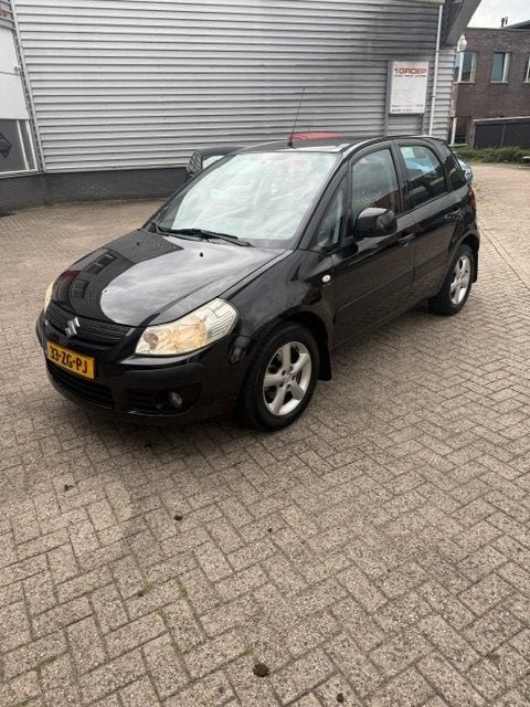 Suzuki SX4 1.6 AUT 2008 Zwart, Auto's, Dealer onderhouden, Stof, 4 cilinders, 1200 kg