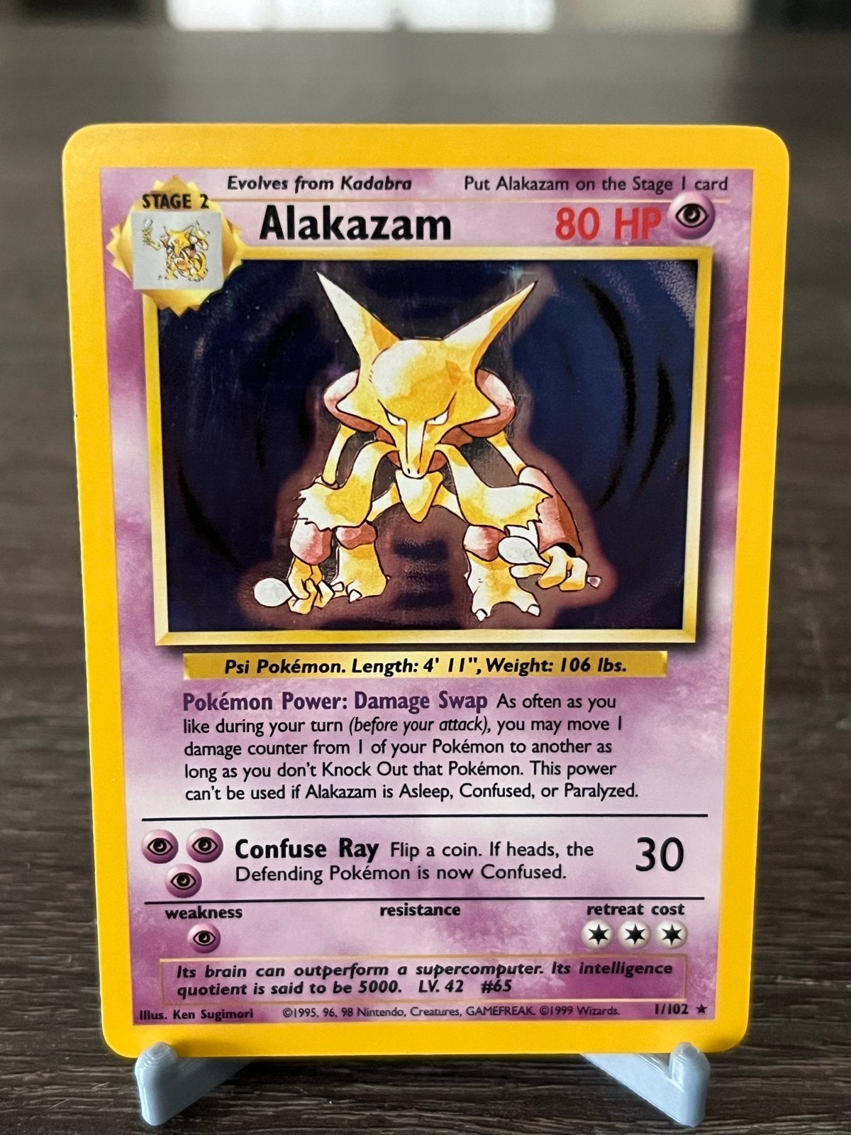 Alakazam (1/102) - Base Set - EX, Hobby en Vrije tijd, Verzamelkaartspellen | Pokémon, Ophalen of Verzenden, Zo goed als nieuw