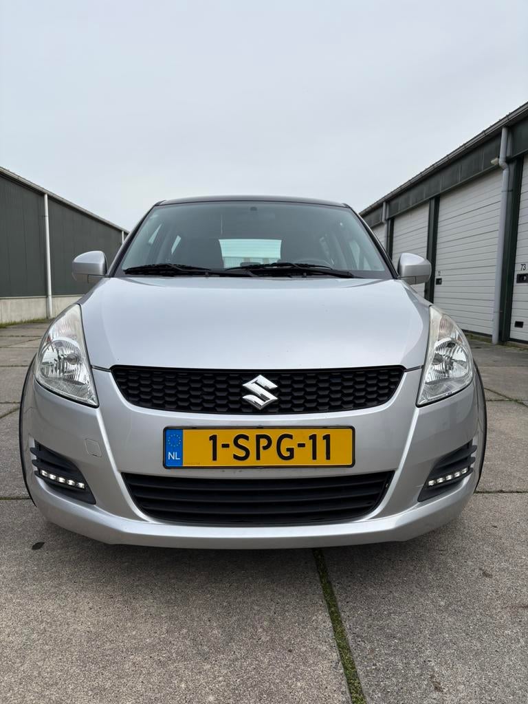 Suzuki Swift 1.2 5-D 2013 Grijs nwe APK NAP, 4 cilinders, 400 kg, Swift, Origineel Nederlands