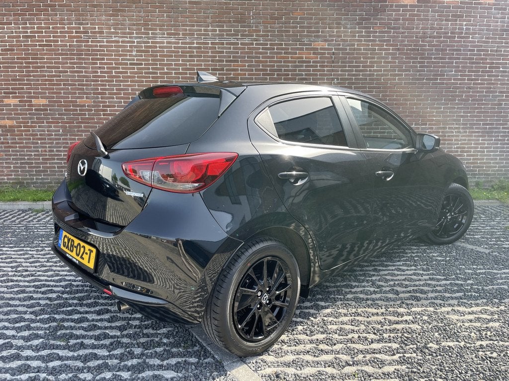 Mazda 2 1.5 e-SkyActiv-G 90 Homura (bj 2024), Auto's, Mazda, 12 maanden, Stof, 4 cilinders, Zwart