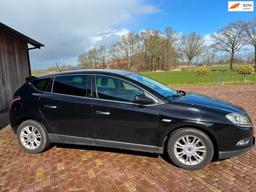 Lancia Delta 1.4-16V Oro, Auto's, Lancia, Voorwielaandrijving, Gebruikt, 4 cilinders, Zwart
