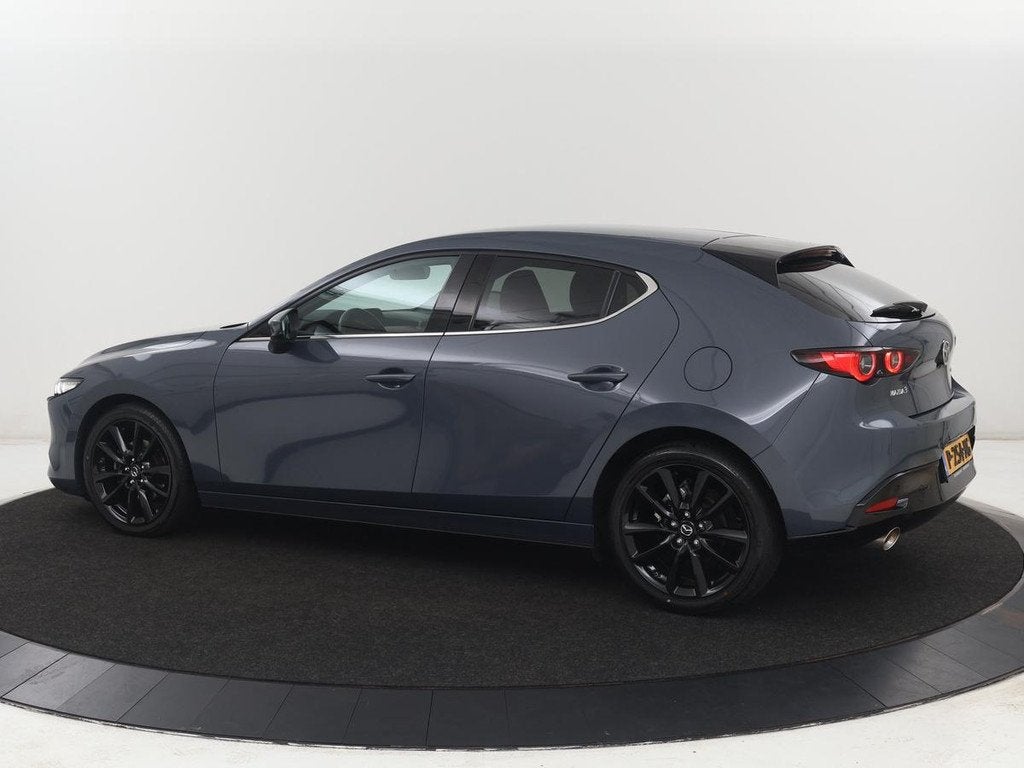 Mazda 3 2.0 e-SkyActiv-X M Hybrid 186 Luxury | Dieprood lede, Auto's, Mazda, Voorwielaandrijving, 1998 cc, Gebruikt, Handgeschakeld