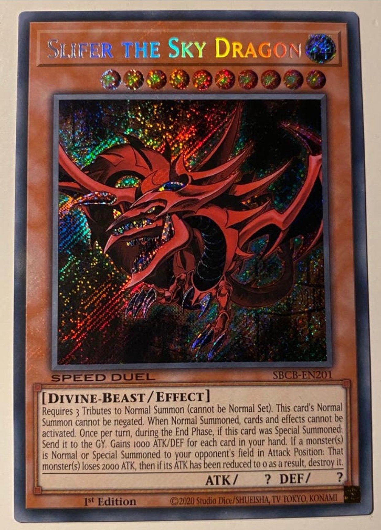 Yu-Gi-Oh! Slifer the Sky Dragon SBCB 1st Edition !, Ophalen of Verzenden, Zo goed als nieuw, Losse kaart, Foil