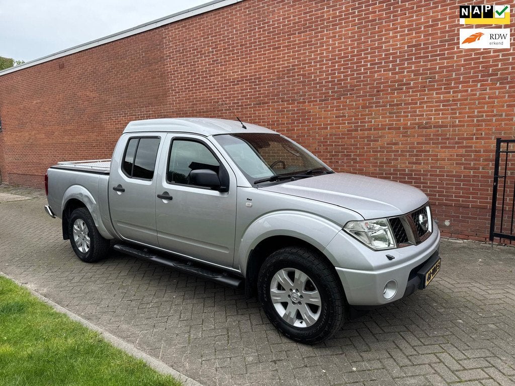 Nissan Navara 2.5 dCi SE Double C. Clima Navi Cruise Automaa, Auto's, Automaat, Stof, Gebruikt, 4 cilinders