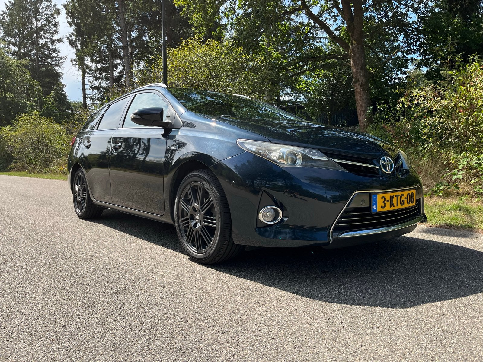 Perfecte dealer onderhouden Toyota Auris Hybrid TS, Auto's, Zwart, 345 kg, Leder en Stof, Origineel Nederlands