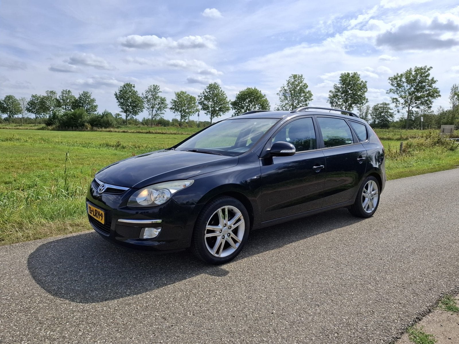Hyundai i30 CrossWagon 2010 – Leren bekleding - APK gekeurd, Auto's, Voorwielaandrijving, 4 cilinders, Zwart, Handgeschakeld