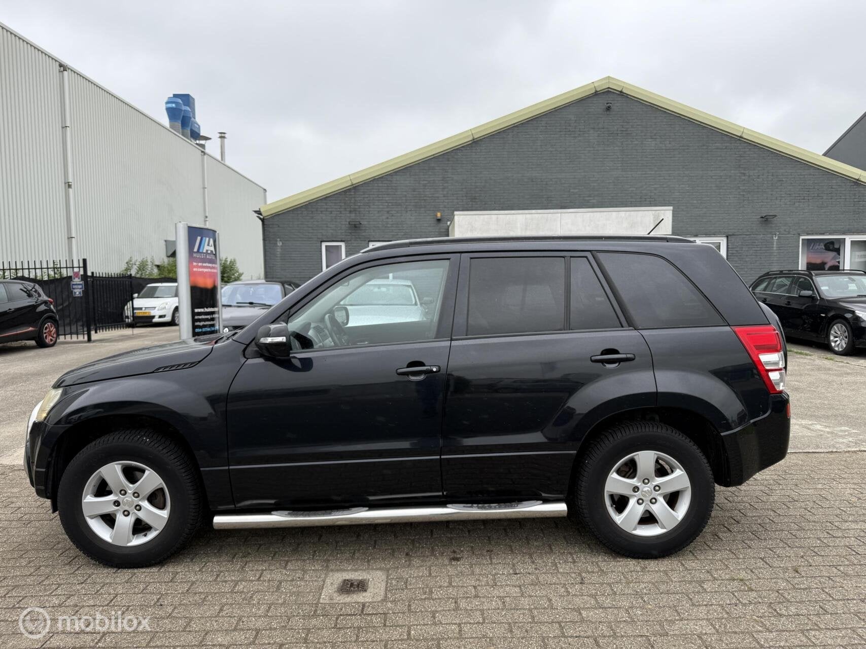 Suzuki Grand Vitara 2.0-16V Exclusive 4x4 2009 | Bull & Side, Stof, 4 cilinders, 1850 kg, Grand Vitara