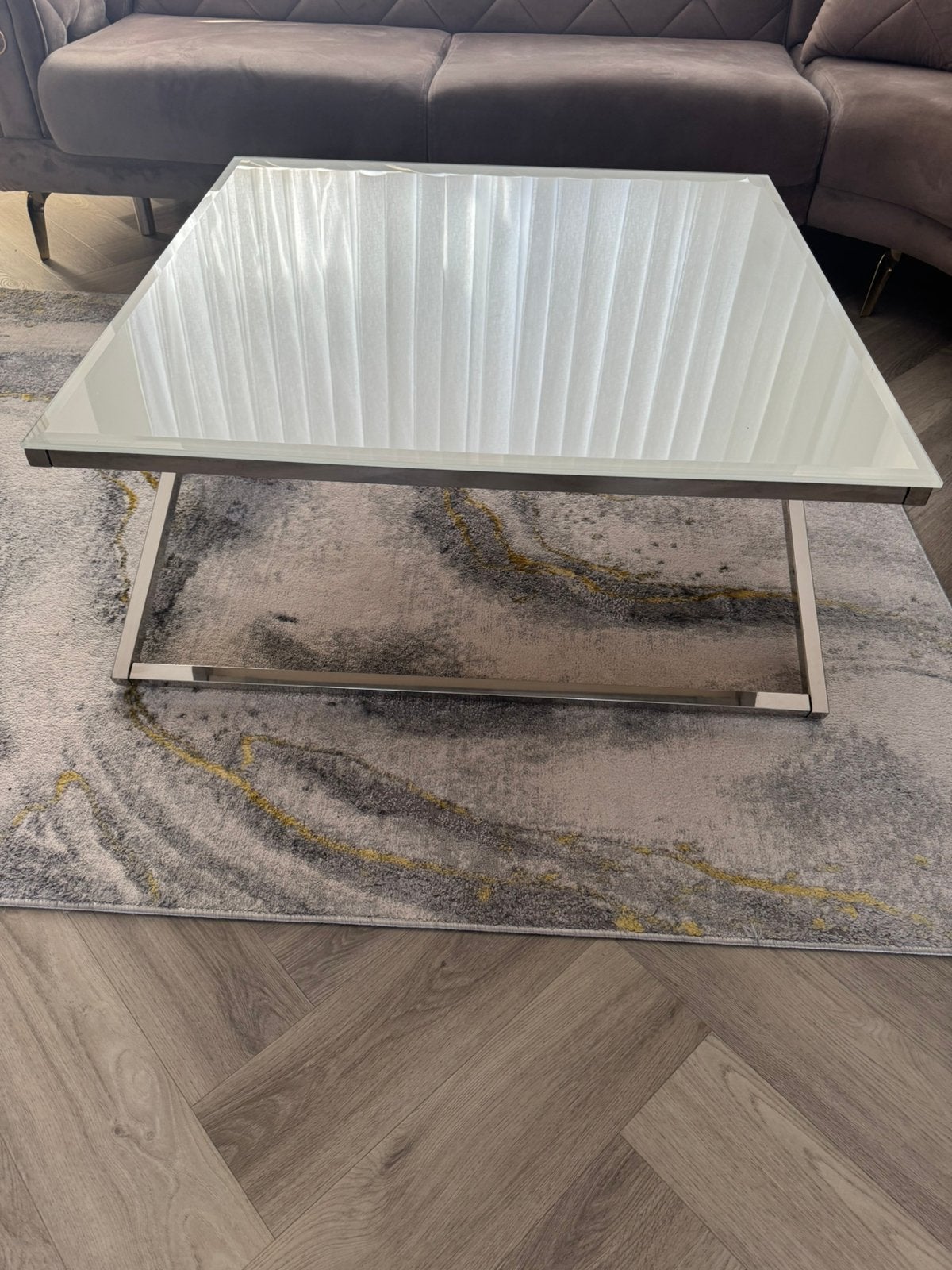 Foto 4 van Moderne salontafel met glazen blad en metalen onderstel