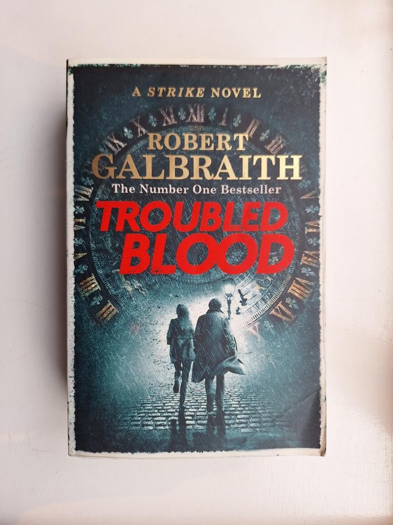 Robert Galbraith - Troubled blood (Engelstalig), Boeken, Robert Galbraith, Amerika, Ophalen, Gelezen