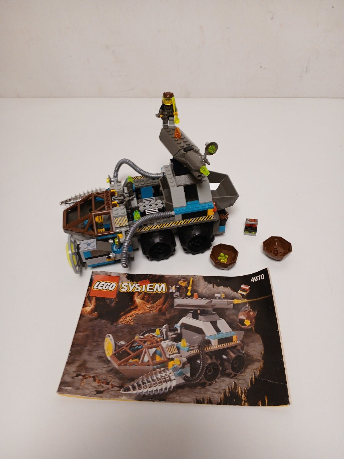 lego 4970 rock raiders - chrome crusher met boekje, Ophalen of Verzenden