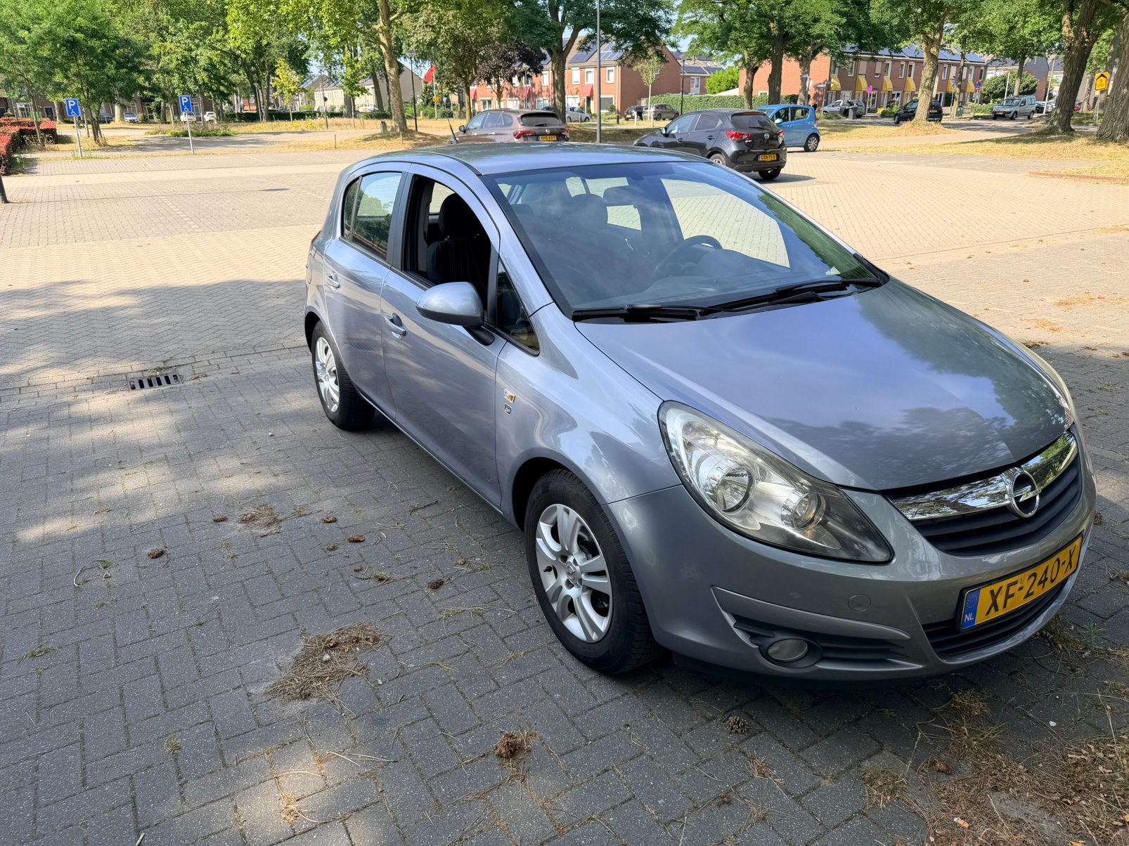 Opel Corsa 1.2 Twinport 85pk 5d 2010 Grijs, Voorwielaandrijving, Stof, Zwart, 4 cilinders