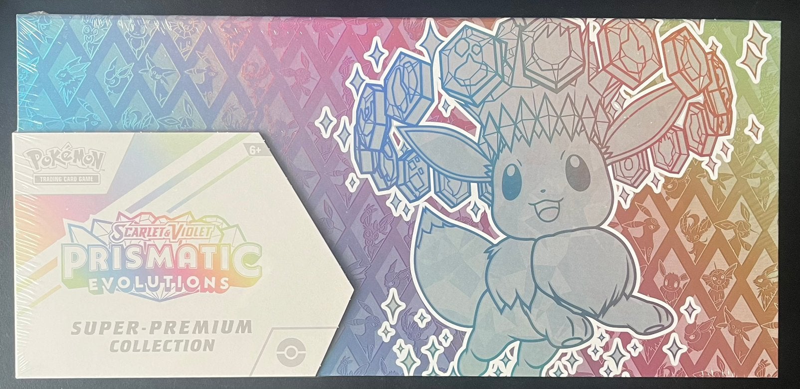 2x Pokemon Prismatic Evolutions Super Premium Collection, Ophalen, Nieuw, Overige typen, Foil