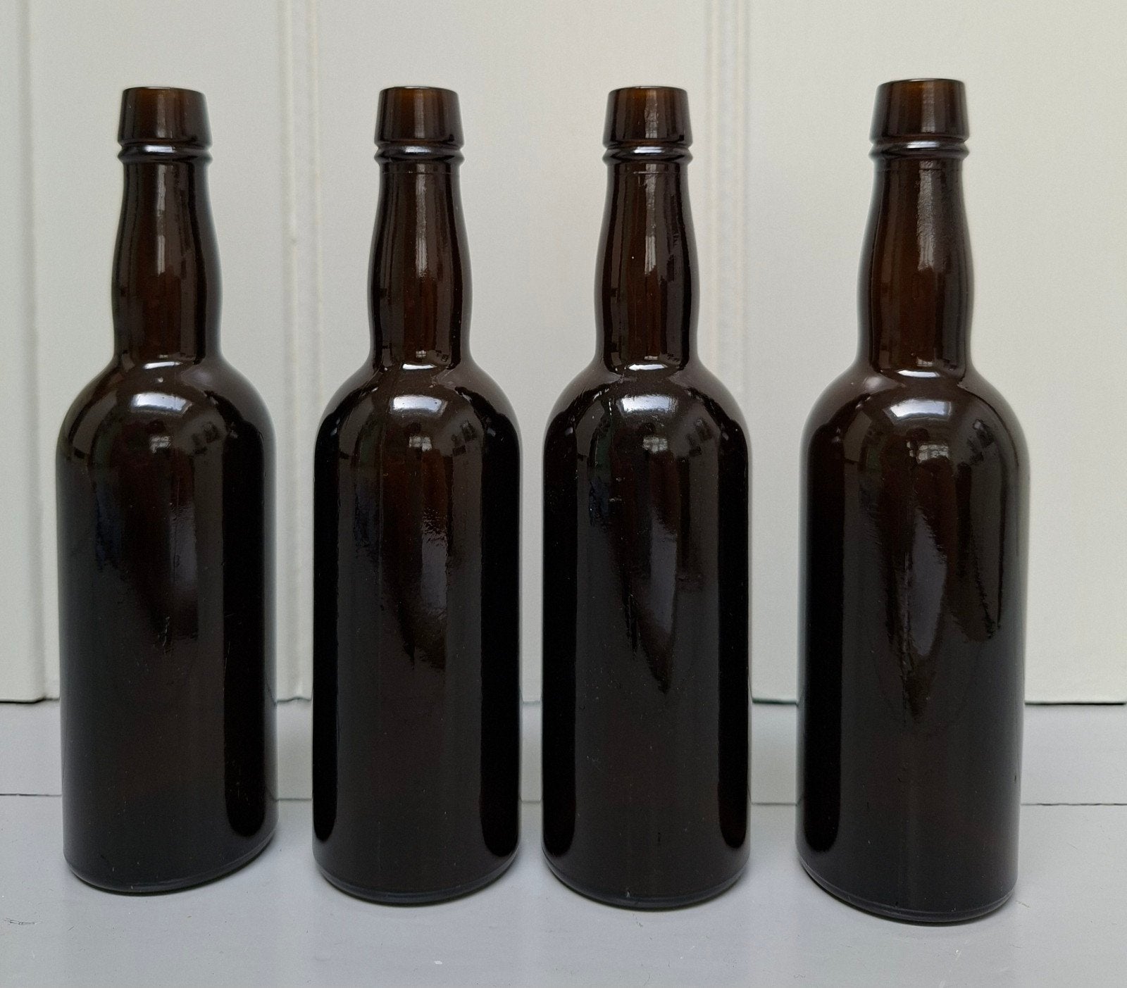 4 glazen vintage bierflesjes, Verzamelen, Biermerken, Ophalen of Verzenden, Zo goed als nieuw, Glas of Glazen, Overige merken