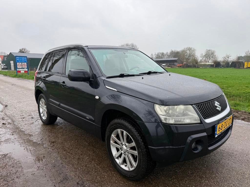 Suzuki Grand Vitara 2.0-16V Limited 4x4, Auto's, Stof, Zwart, 4 cilinders, 1850 kg