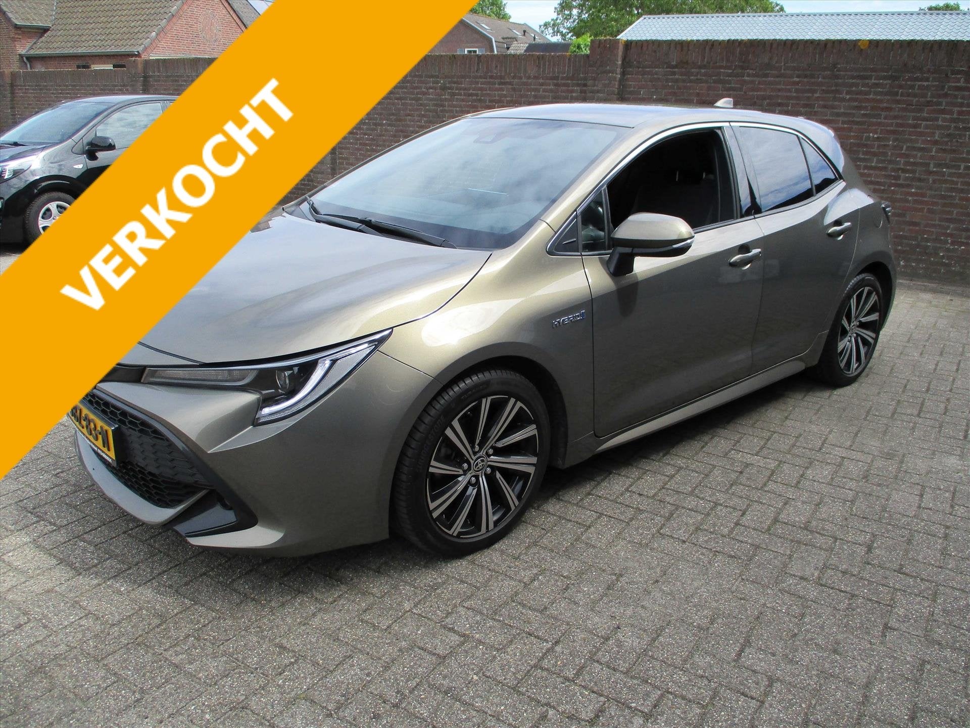 Toyota Corolla 1.8 Hybrid Business Automaat Camera Carplay, Auto's, Automaat, Gebruikt, 4 cilinders, Bruin