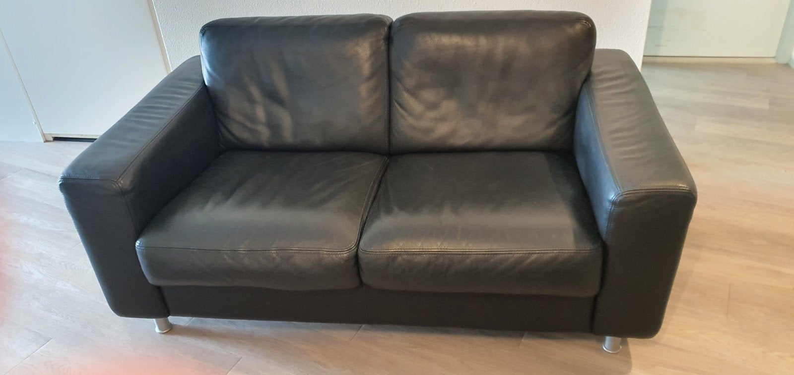 Zwart leren bankstel,  2 zit en 2x fauteuil
