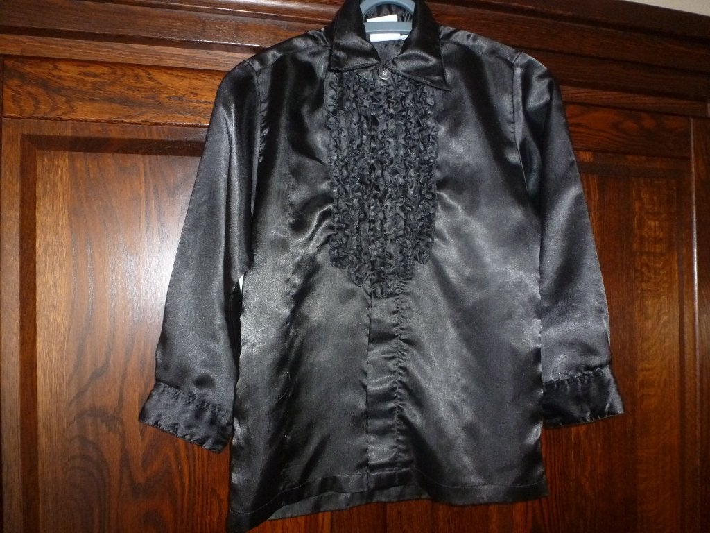 1 mooie zwarte ruches, disco blouse lange mouwen maat 128, Kinderen en Baby's, Ophalen of Verzenden, Zo goed als nieuw, 122 t/m 128