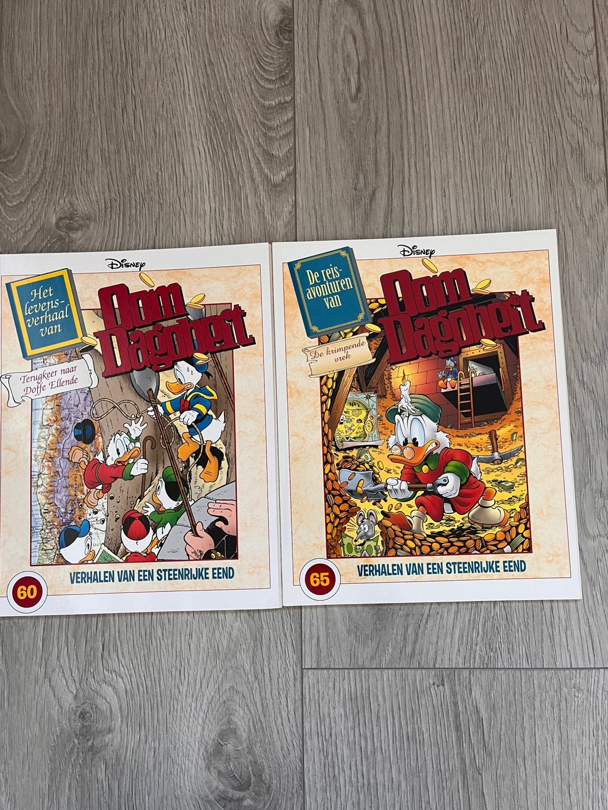 2x Oom Dagobert Strips nummer 60 en 65, Boeken, Ophalen of Verzenden, Zo goed als nieuw