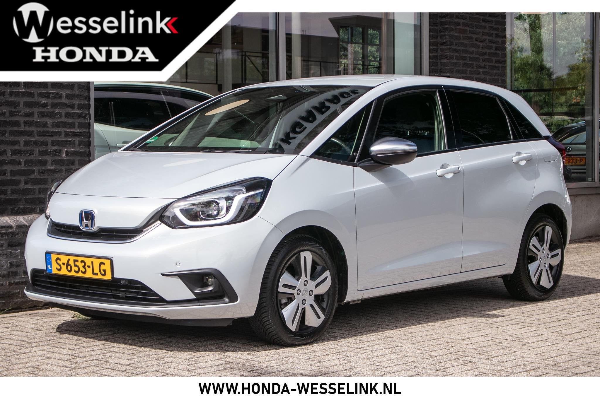 Honda Jazz 1.5 e:HEV Executive | All Season banden | Camerra, Auto's, Honda, Dealer onderhouden, Euro 6, Leder en Stof, Wit