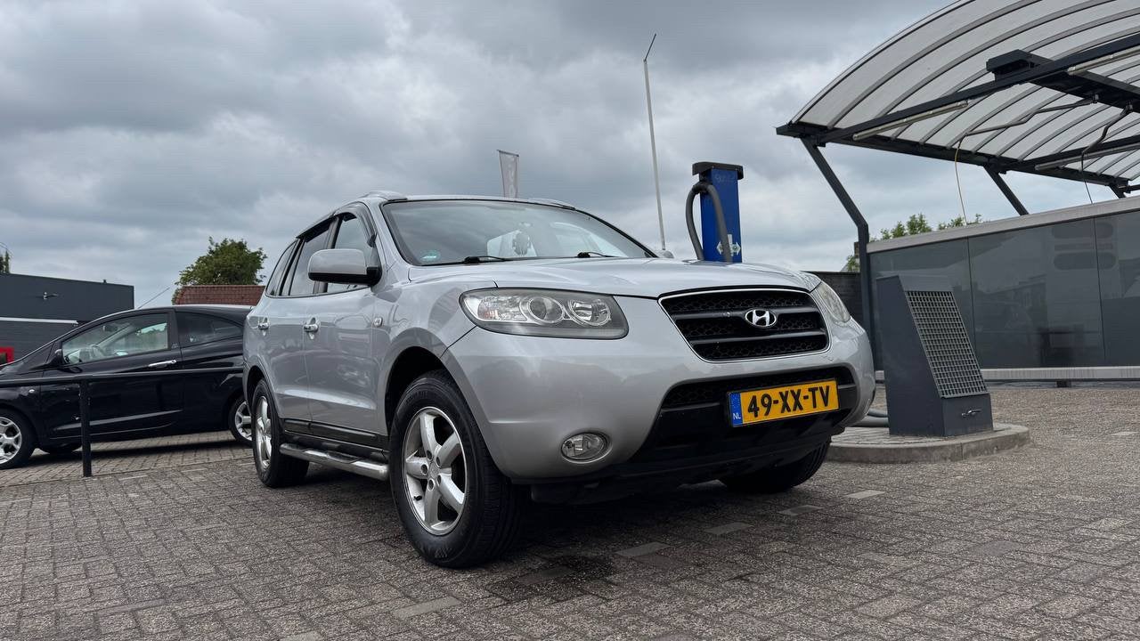 Hyundai Santa Fe 2.7 2WD 7-ST 2007 Grijs, Auto's, Voorwielaandrijving, Santa Fe, 2000 kg, Handgeschakeld