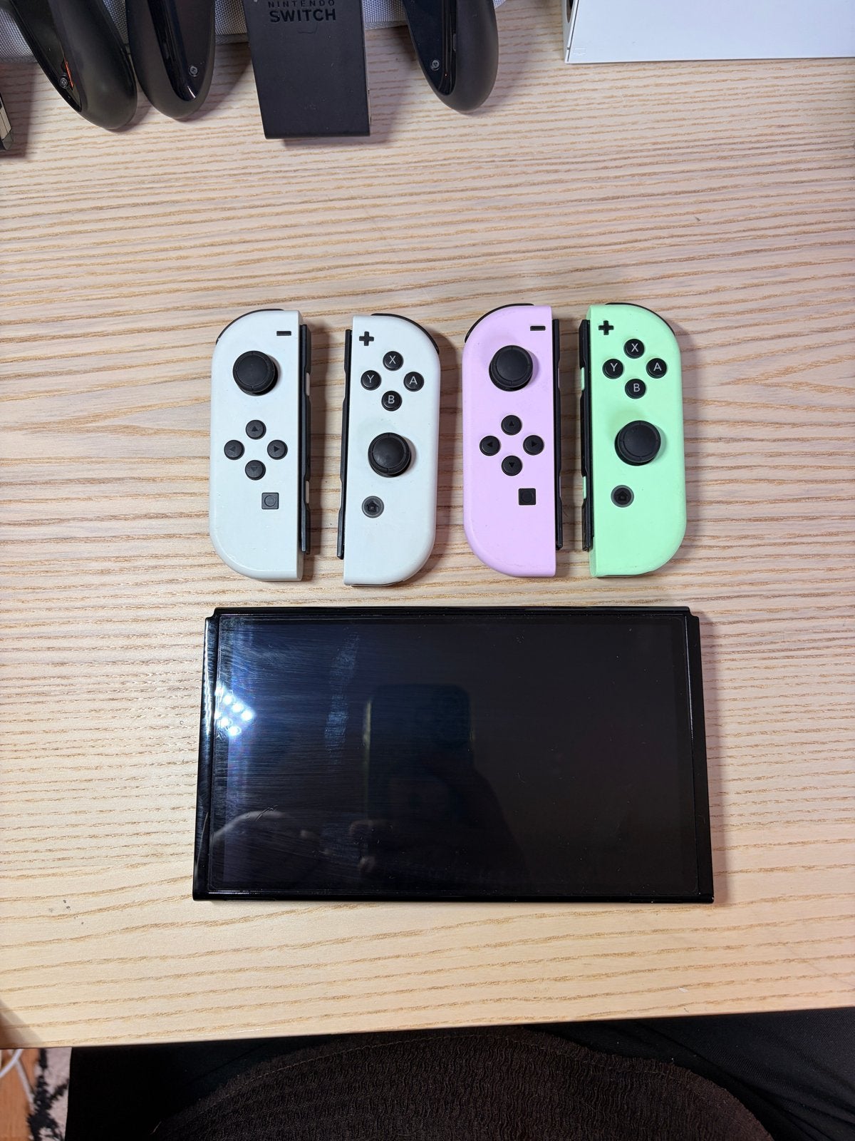 Foto 7 van Nintendo Switch OLED met extra controllers en games