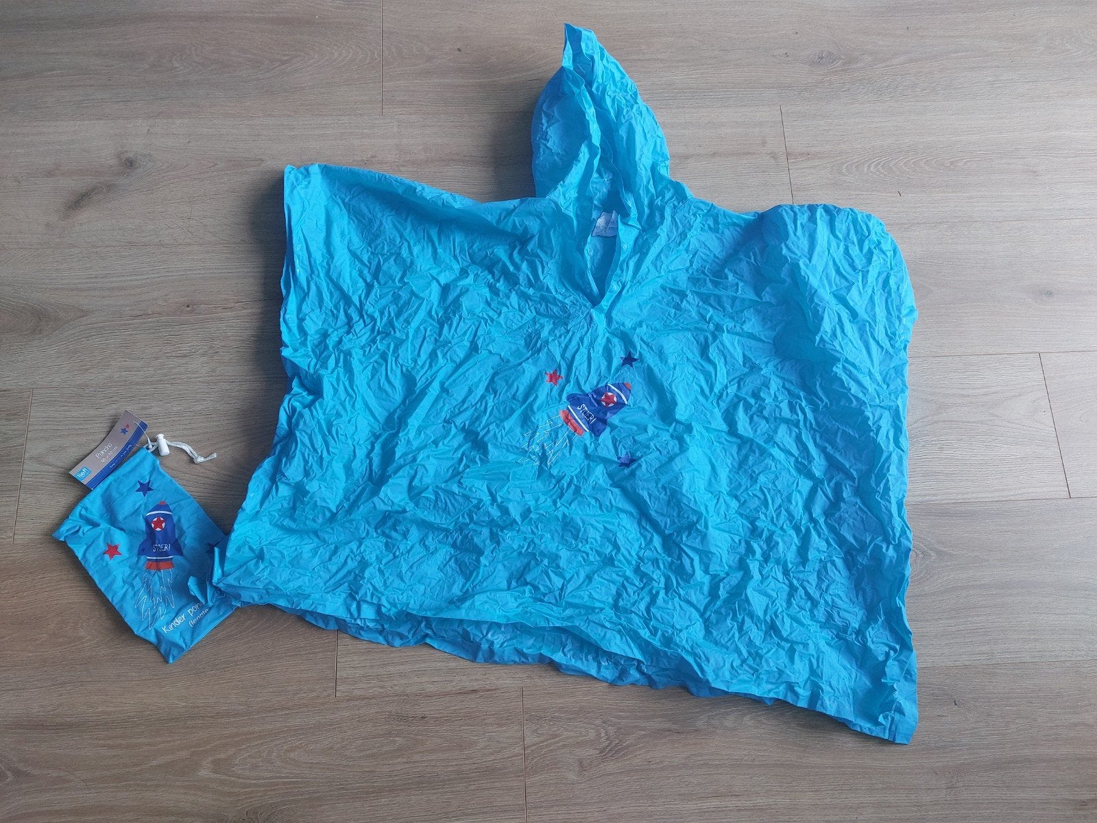Stoer! Regenponcho met raketprint en opbergzakje, Ophalen of Verzenden, Zo goed als nieuw