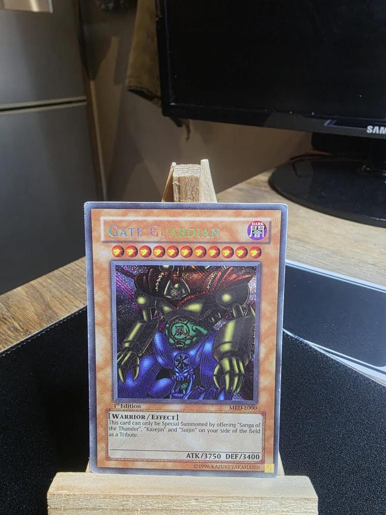 Yu-Gi-Oh! TCG - Gate Guardian MRL-E000 (1st) + Extra, Ophalen of Verzenden, Gebruikt, Losse kaart, Foil