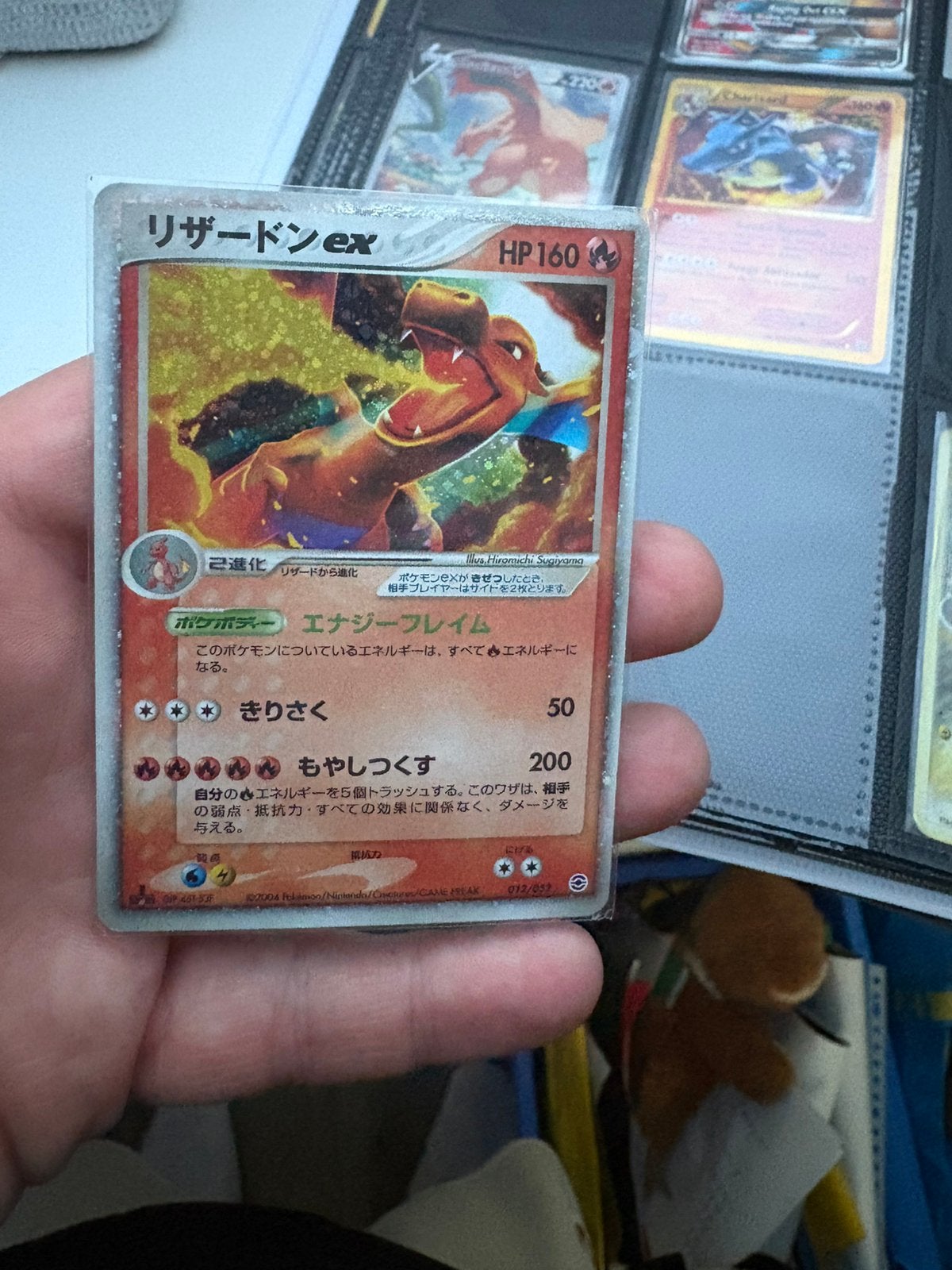 Charizard ex 1st edition, Ophalen of Verzenden, Zo goed als nieuw, Meerdere kaarten, Foil
