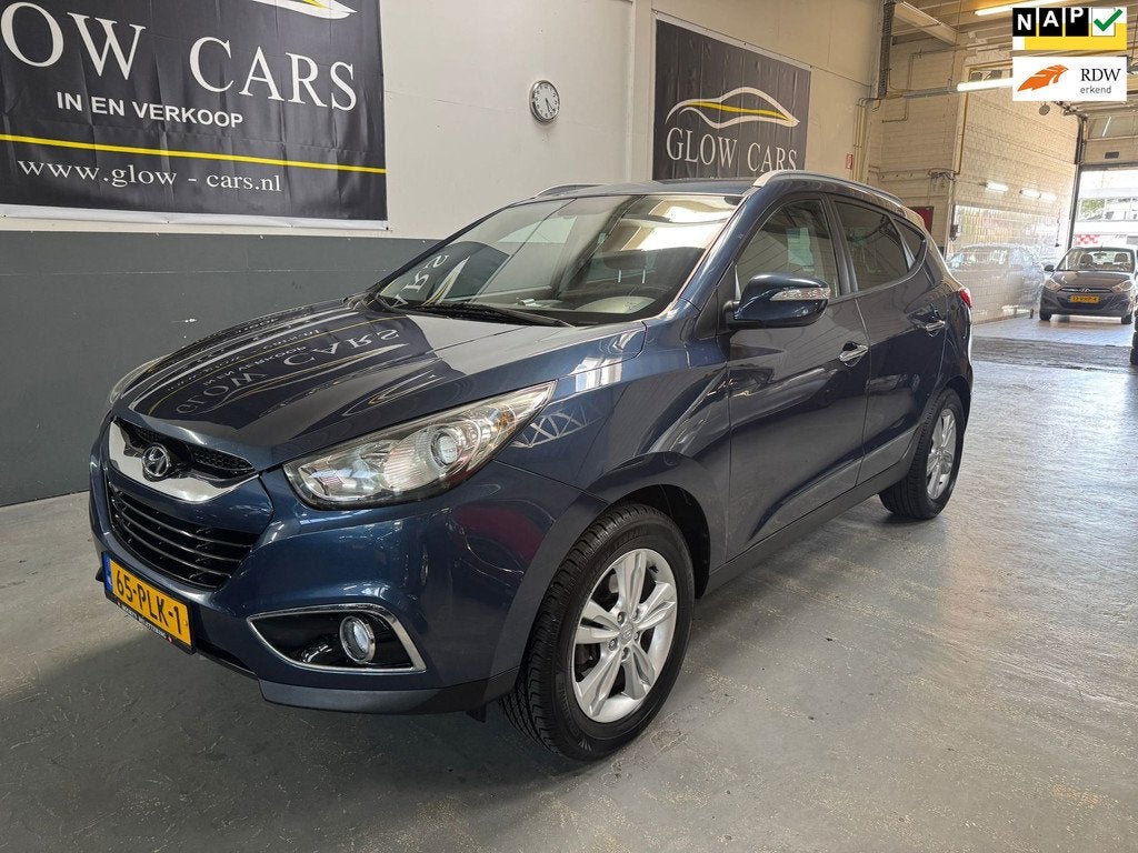 Hyundai Ix35 2.0i Style AIRCO|CRUISE|PDC|TREKHAAK|BLUETOOTH|, Auto's, Hyundai, Zwart, 4 cilinders, Blauw, Leder en Stof