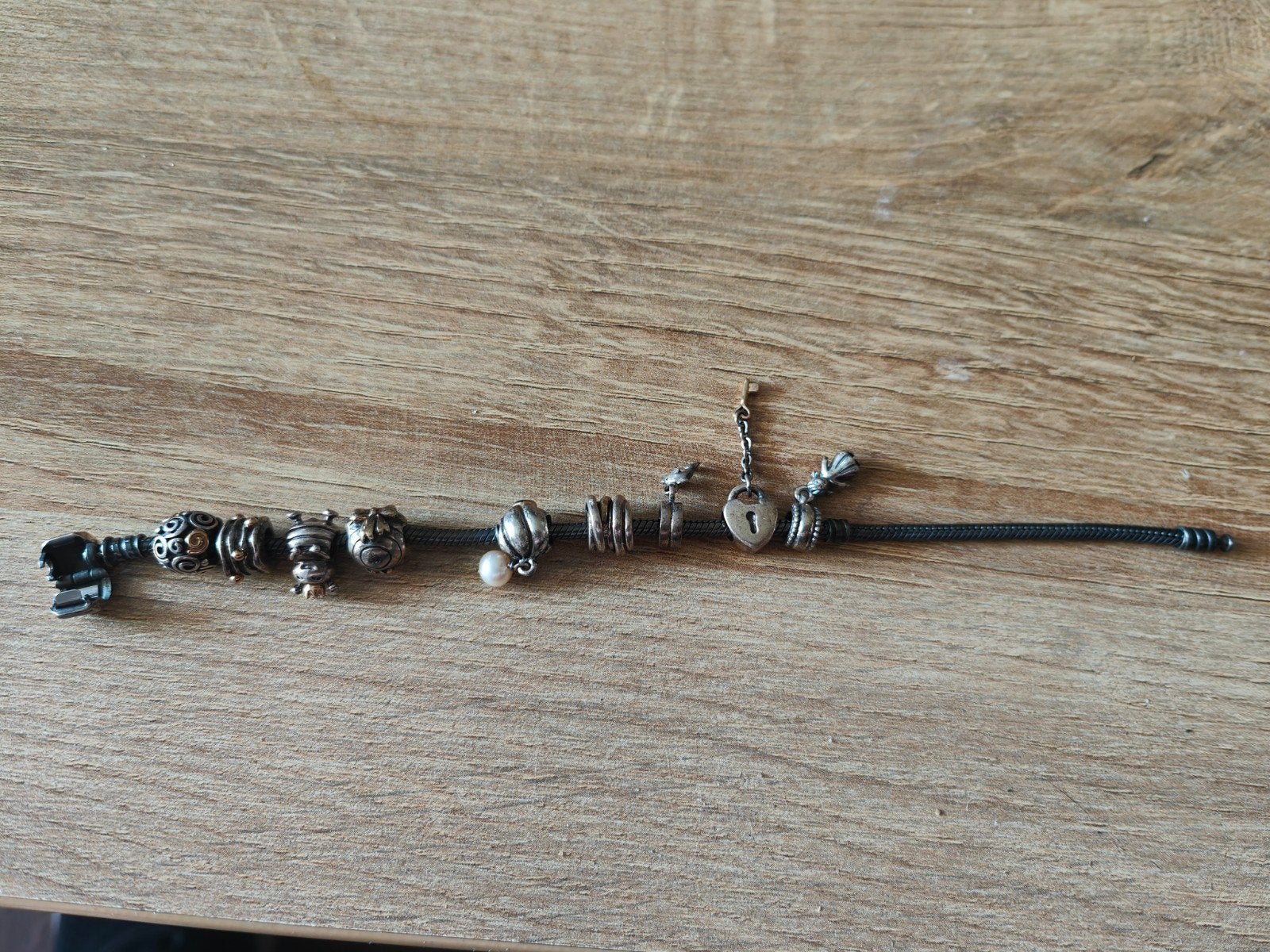 Pandora armband 20 cm met zilver/goud bedels., Gebruikt, Pandora, Ophalen of Verzenden, 4 bedels of meer