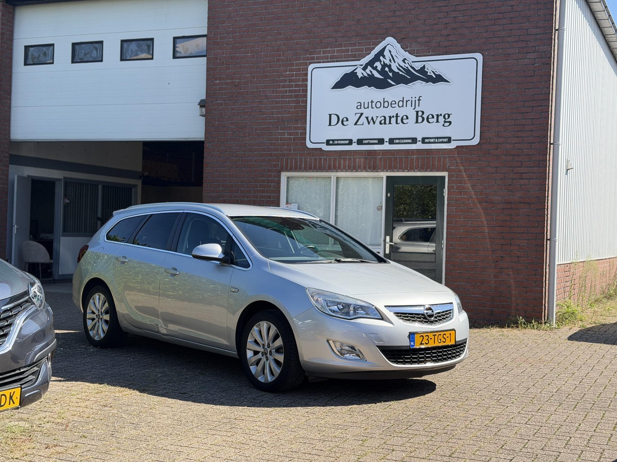 Opel Astra Sports Tourer 1.4 Turbo Cosmo, Auto's, Voorwielaandrijving, Euro 5, Stof, Gebruikt