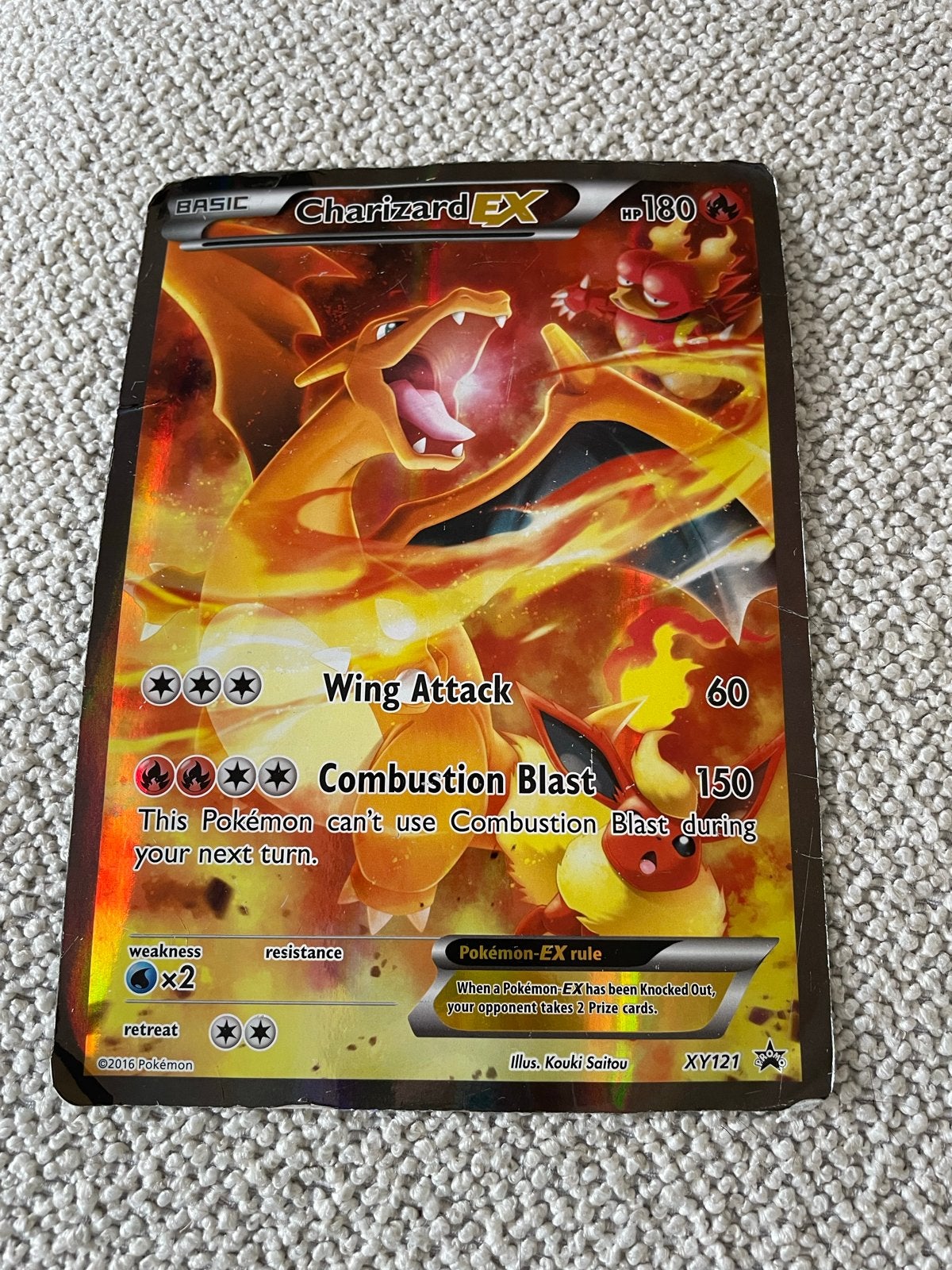 Beschadigde Charizard EX Pokémonkaart - Holofoil XY121, Ophalen of Verzenden, Gebruikt, Losse kaart, Foil