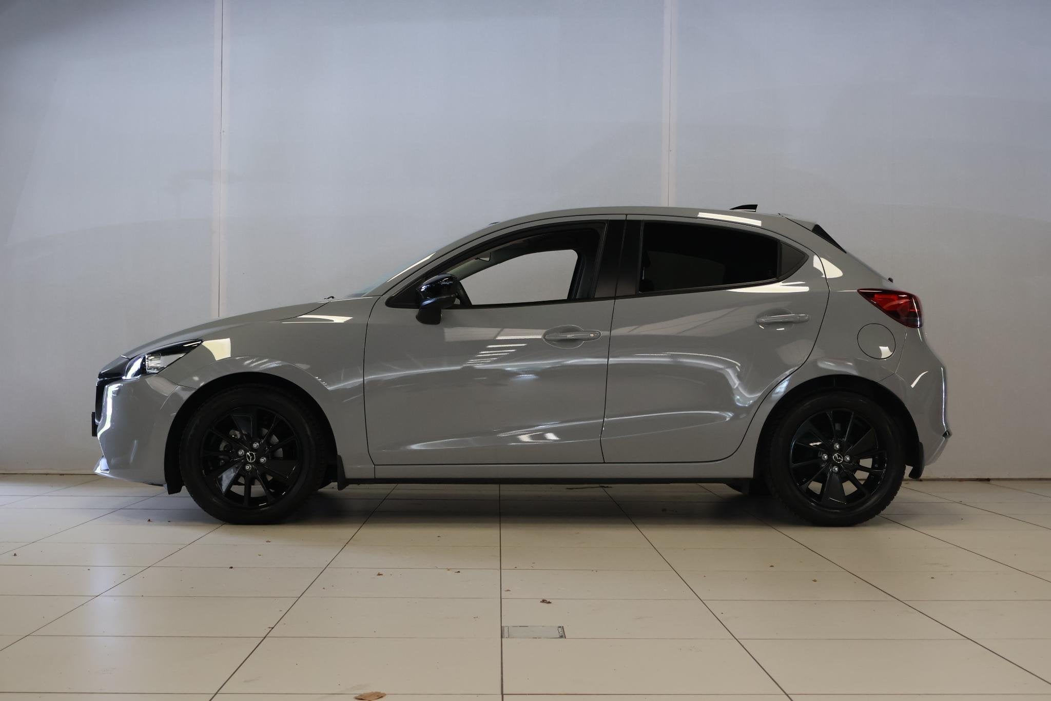 Mazda 2 1.5 e-SkyActiv-G 90 Homura, Auto's, Stof, 4 cilinders, Met garantie (alle), Origineel Nederlands