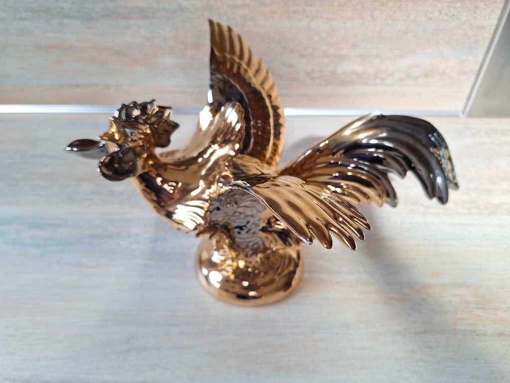 Gouden Kip 24 Karaat Goud, Ophalen