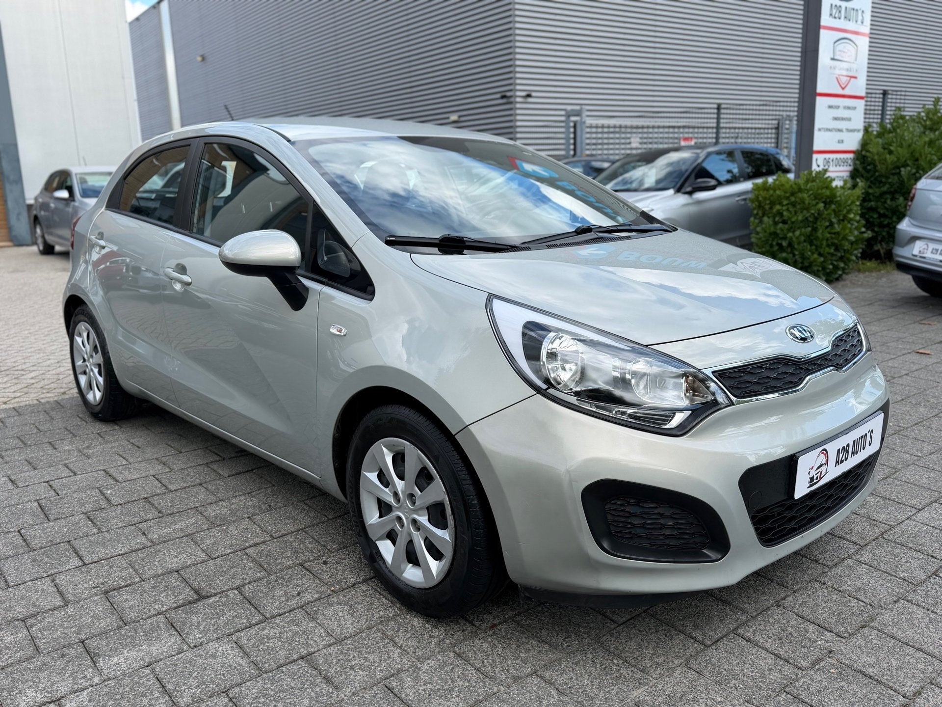 Kia Rio 1.2 CVVT Comfort Pack|Airco|Cruise contr|Line assist, Auto's, 4 cilinders, Verwarmde buitenspiegels, Beige, Origineel Nederlands