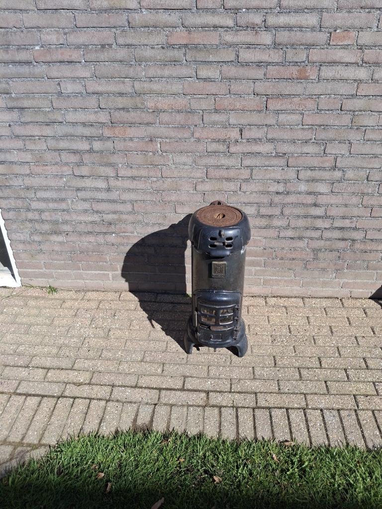 Antiek oude potkachel, Ophalen