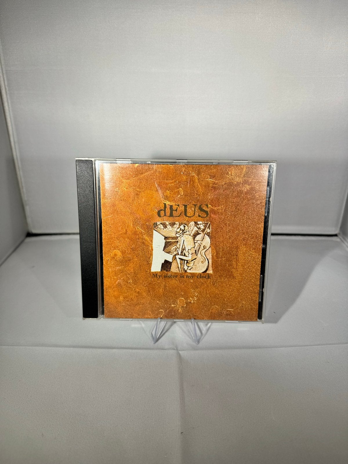 dEUS - My Sister Is My Clock CD (1995), Cd's en Dvd's, Ophalen of Verzenden, Zo goed als nieuw, EP, Inclusief boekje
