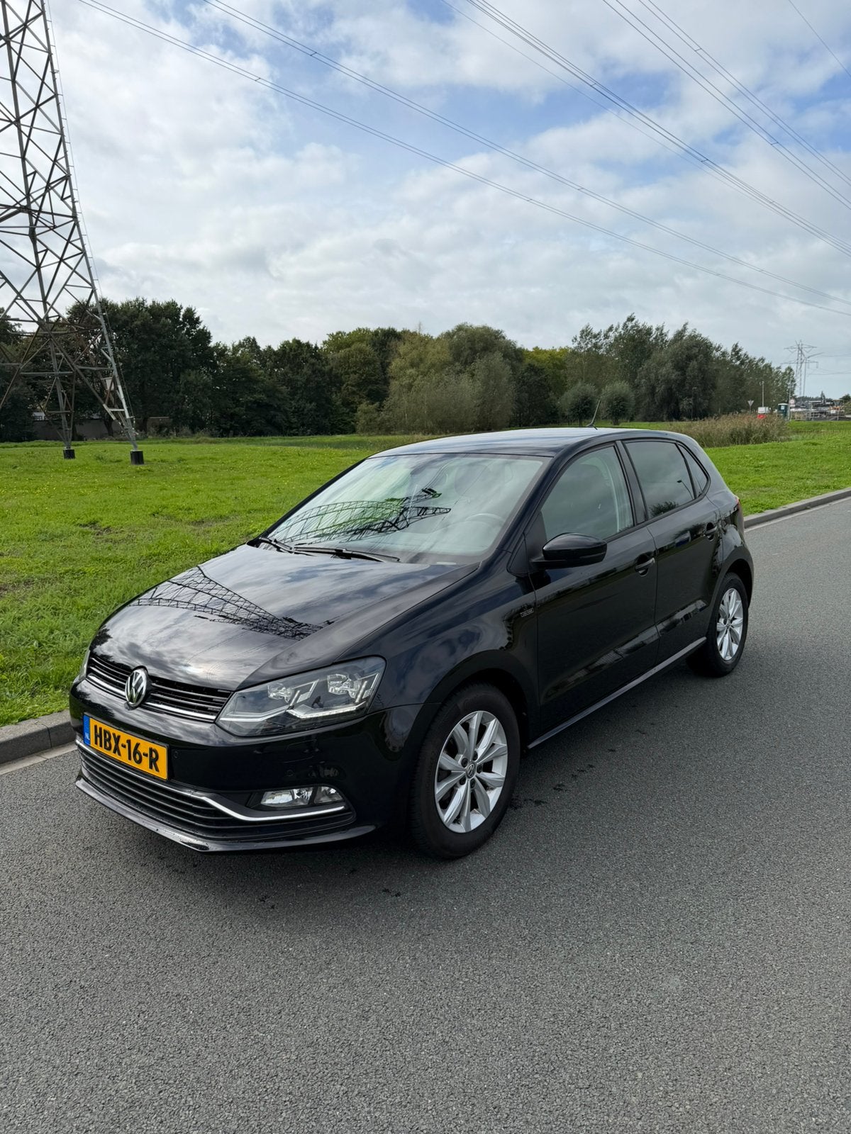 Volkswagen Polo 1.2 TSI 66KW 2016 Zwart, Auto's, Dealer onderhouden, Stof, 4 cilinders, Zwart