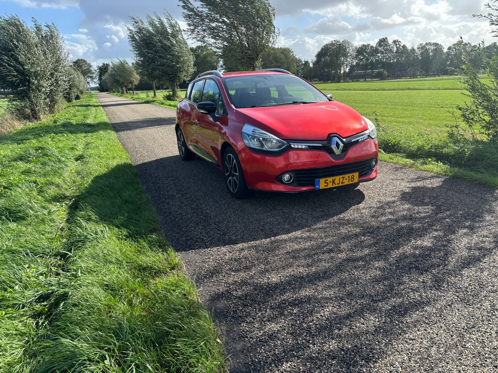 Renault Clio Energy TCe 90pk S&S 2013 Rood, Auto's, Voorwielaandrijving, 898 cc, Stof, Origineel Nederlands