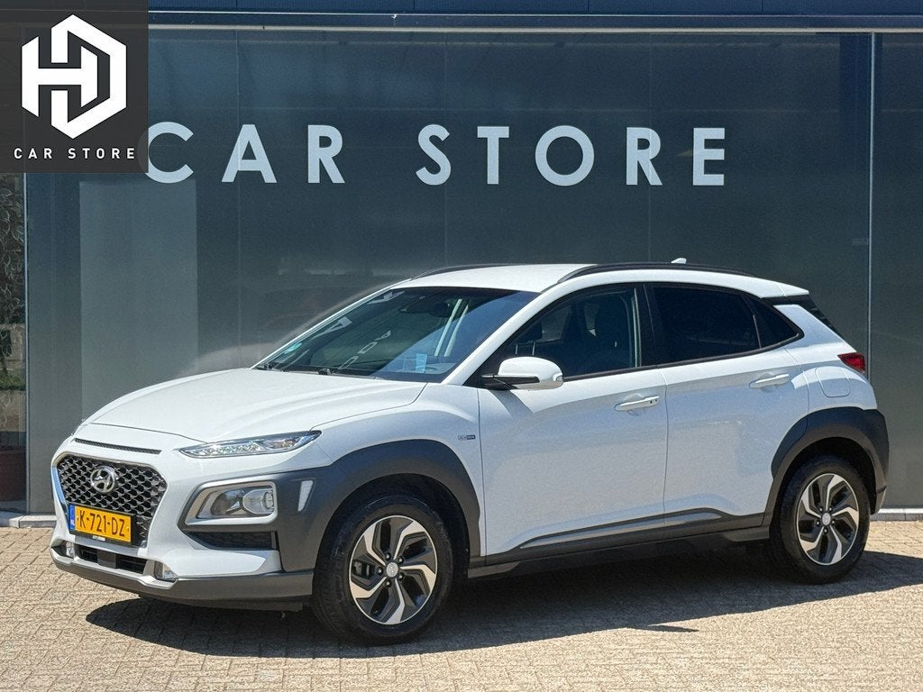 Hyundai Kona 1.6 GDI HEV Fashion Navi|Carplay|Stoelver|Dodeh, Auto's, Hyundai, Stof, Gebruikt, Automatische klimaatregeling, Wit