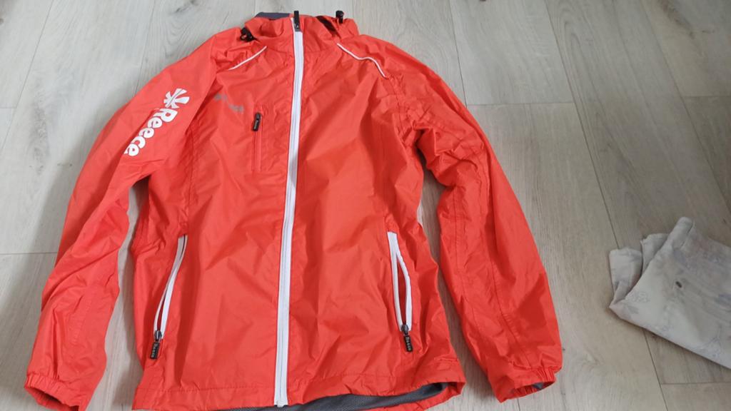 Reece regenjas oranje, Oranje, Ophalen of Verzenden, Zo goed als nieuw, Maat 36 (S)