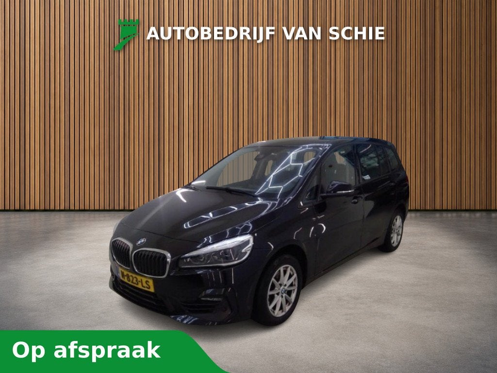 BMW 2 Serie Gran Tourer 216i 7p. Business Edition Plus 1e-Ei, Auto's, 12 maanden, Gebruikt, 7 stoelen, Zwart