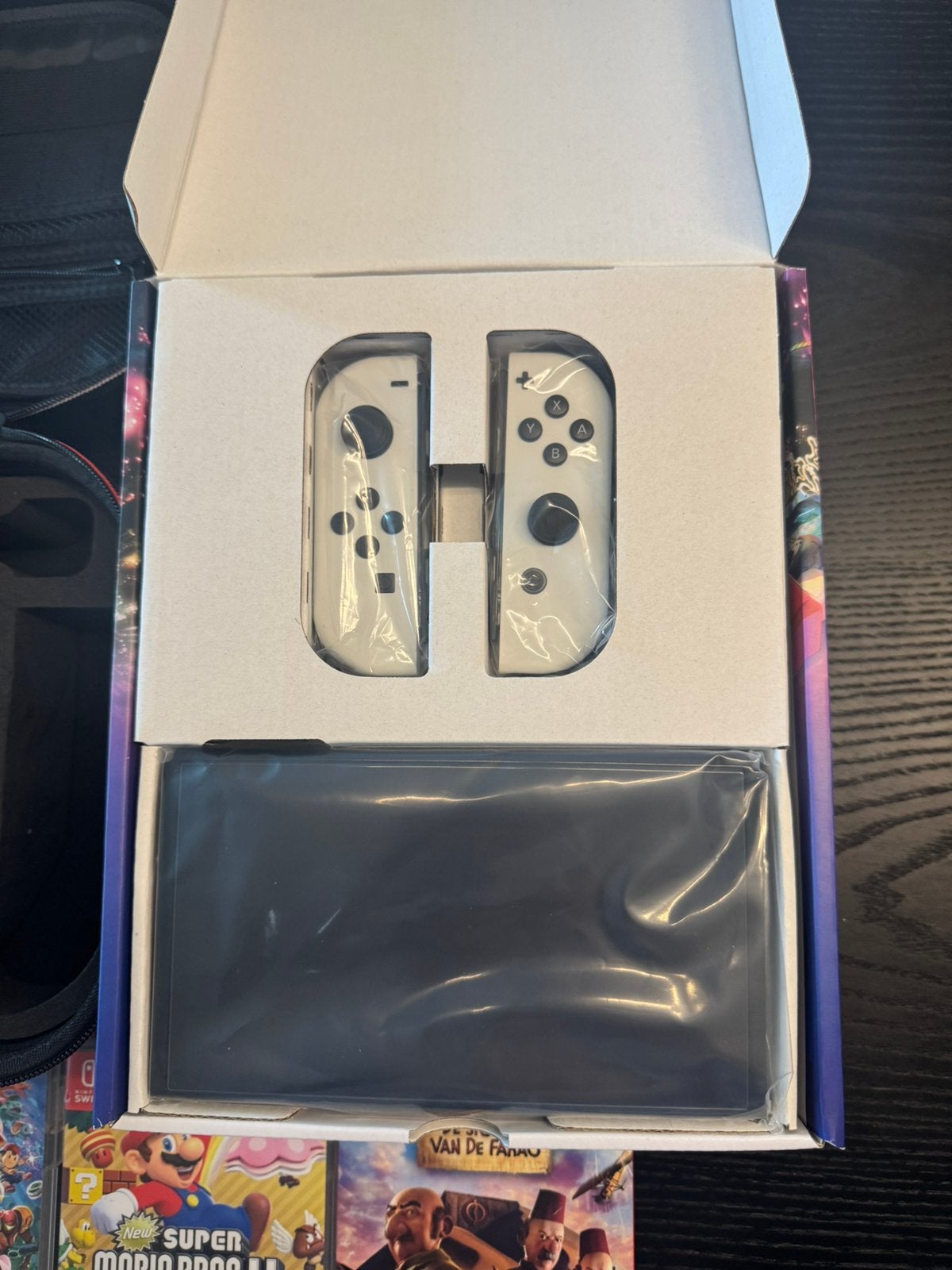 Nintendo Switch OLED – nieuw + 4 spellen + accessoires